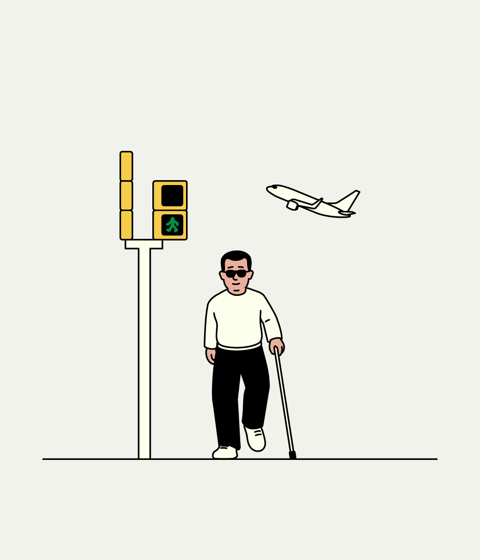 Person with a white cane crossing at a pedestrian signal with audio cues while an airplane flies overhead.